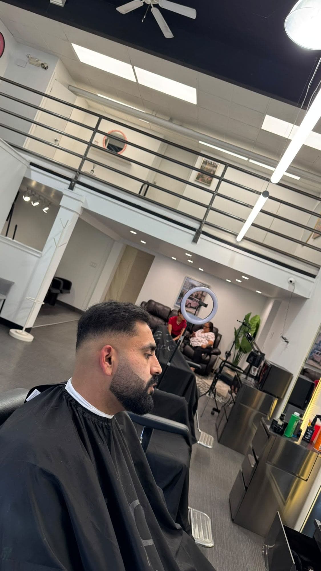 Skin fade with a full sculpted beard at Glasscut Barbershop