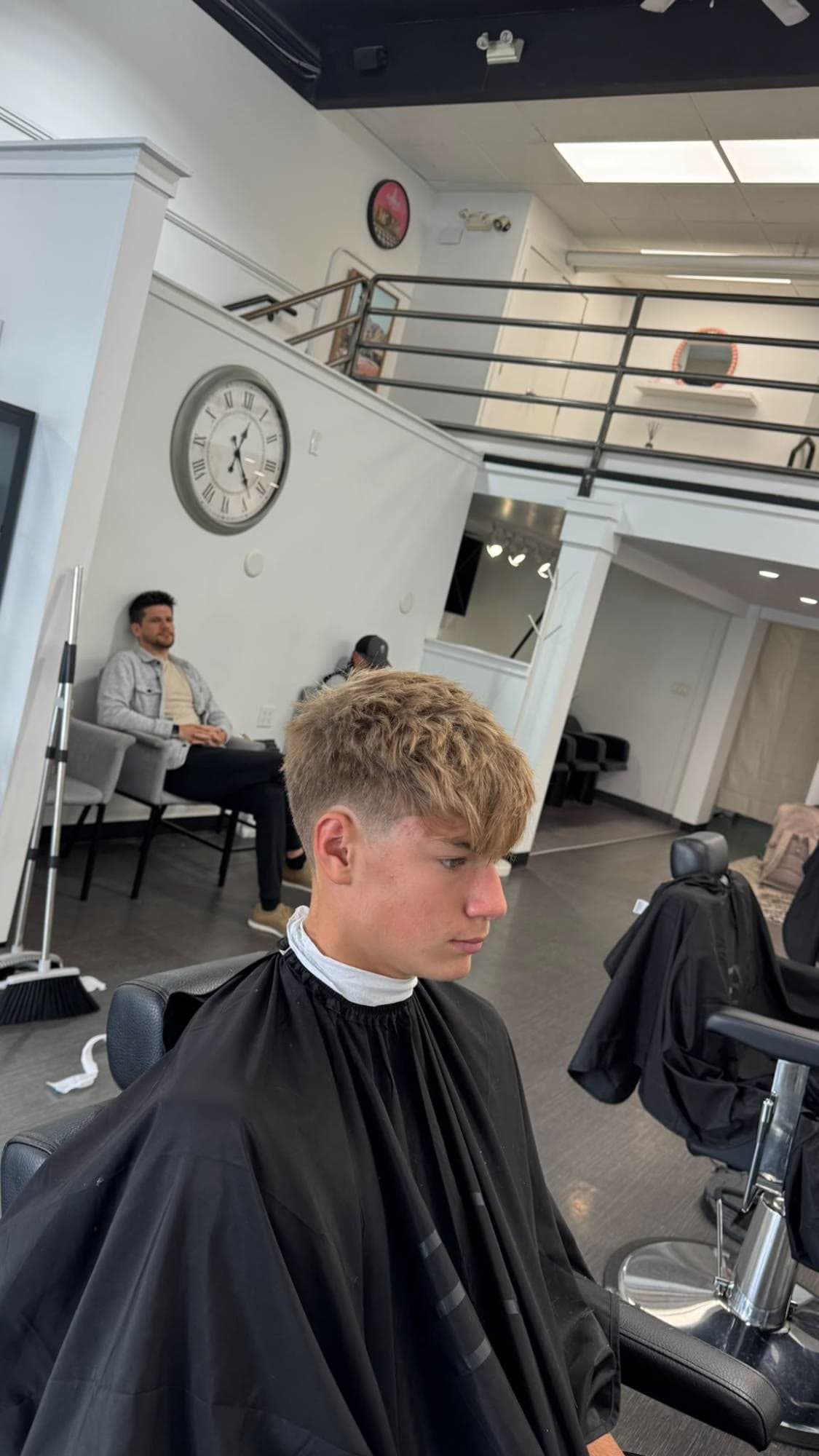Textured fringe with a low taper, inside Glasscut Barbershop