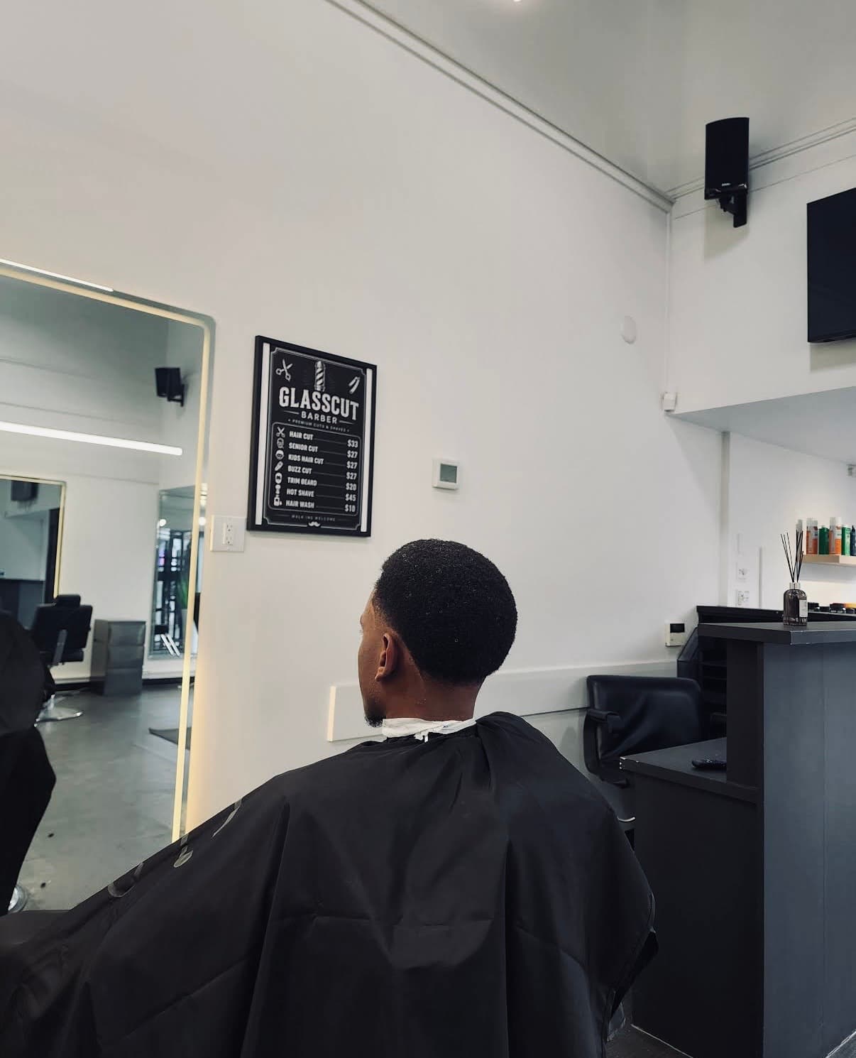Client in the chair at Glasscut Barbershop