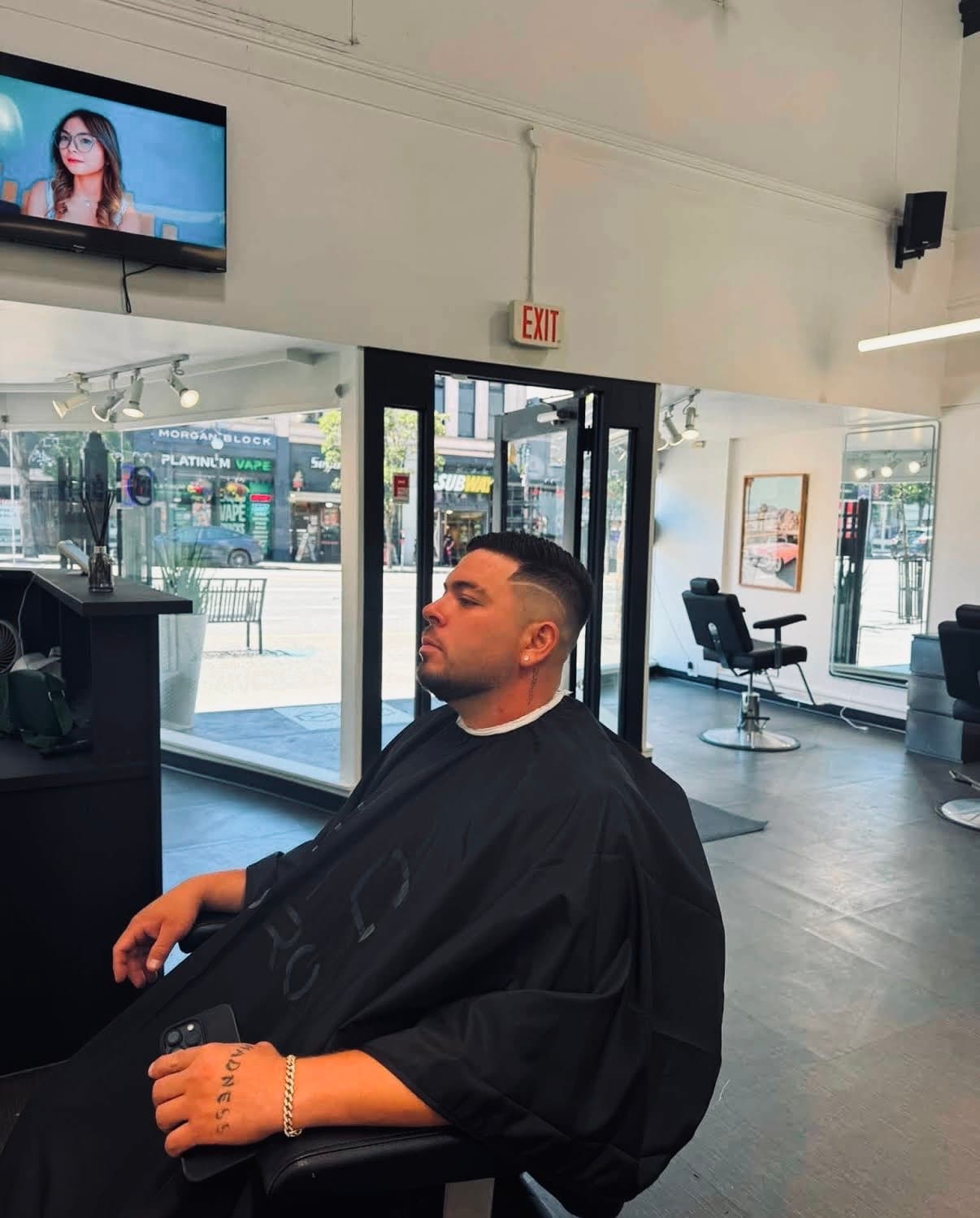 Waiting area inside Glasscut Barbershop